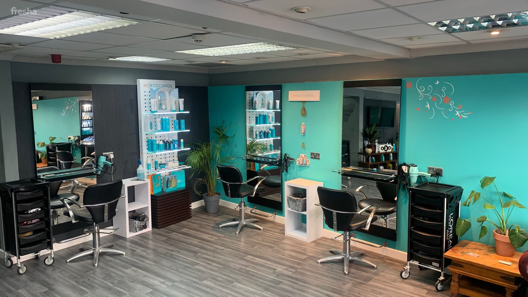 Warm, low-lit interior of La'torias Hair in Carmarthen